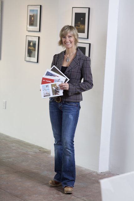 Woman Holding Folder and Wearing Long Sleeve Jeans
