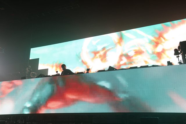 DJ Silhouette Against Massive LED Stage Display