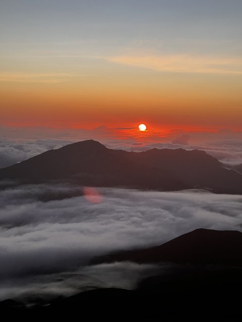Sunrise Over the Clouds
