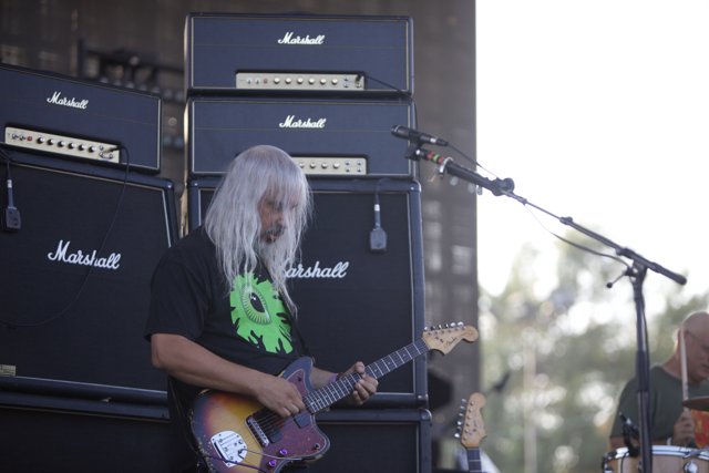 White-haired Guitarist Rocks the Stage