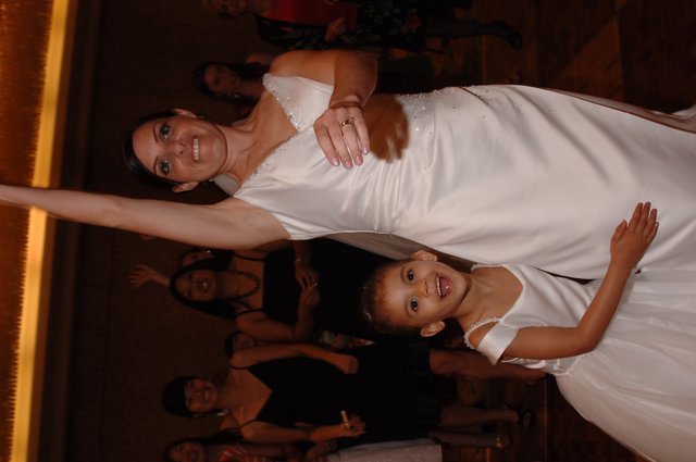 Bride and Flower Girl Celebrate at Wedding Reception