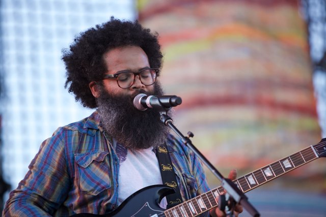 Kyp Malone rocking the stage with his electric guitar at Coachella 2009