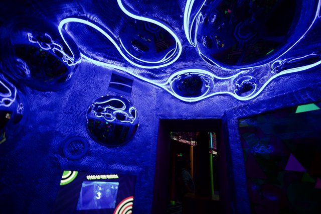Immersive Bioluminescent Cell Installation in Blue UV Light