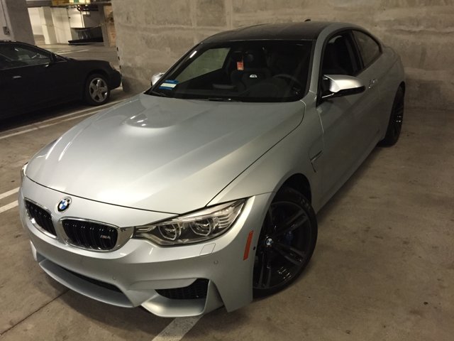 BMW M4 parked in LA garage