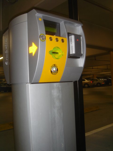 Yellow Arrow on a Parking Meter
