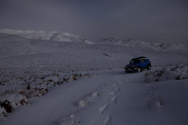 Blue SUV in the Snow