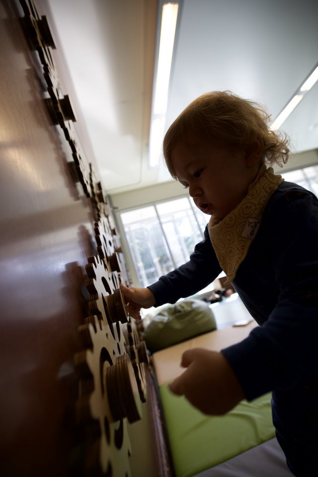 Young Child Engaged in Interactive Learning Play