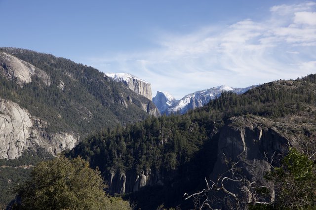 Snow-Capped Peaks Beyond Yosemite Valley Granite Cliffs