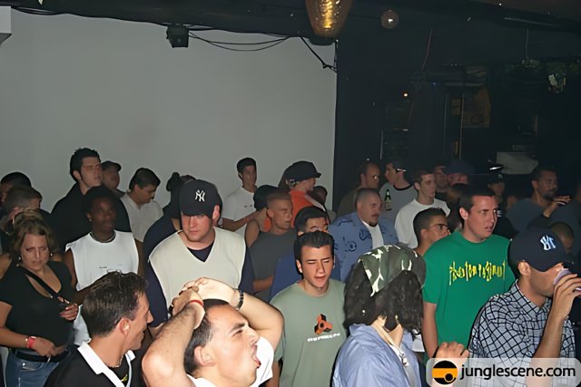 Nightclub Crowd with Man in Green Shirt