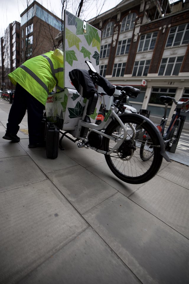 Delivery Cyclist Navigating Urban Streets in Hi-Vis Gear