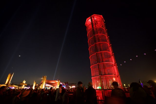 Red Tower Illuminates Urban Night Life