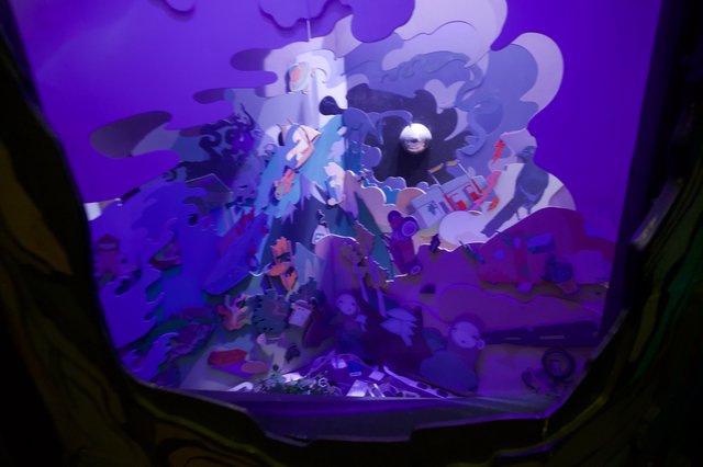 Illuminated Three-Dimensional Pop-Up Art Installation in Purple Light