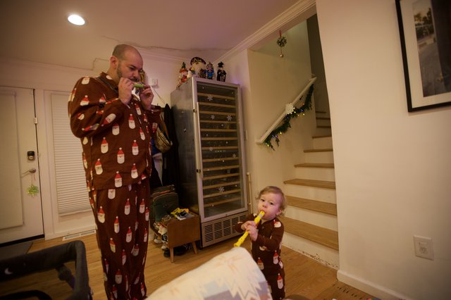 Father and Child's Matching Christmas Morning Fun