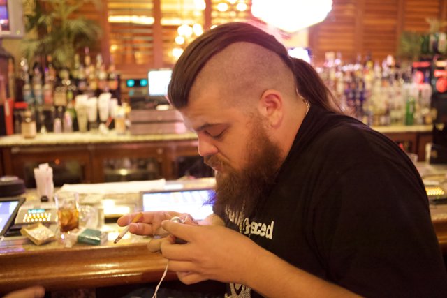 Mohawk Man Enjoying Drinks at Defcon Pub