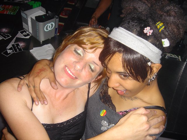 Two Friends Embracing at a Late Night Party