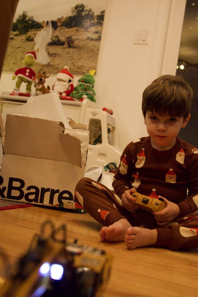 Boy Playing with Remote Control Toy on Christmas Morning