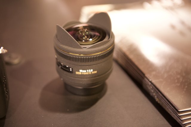 A Close-Up of Camera Lens on Table