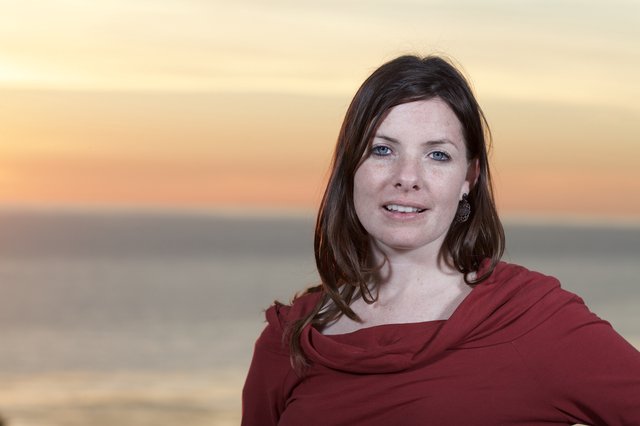 Woman in Red at Golden Hour Seaside