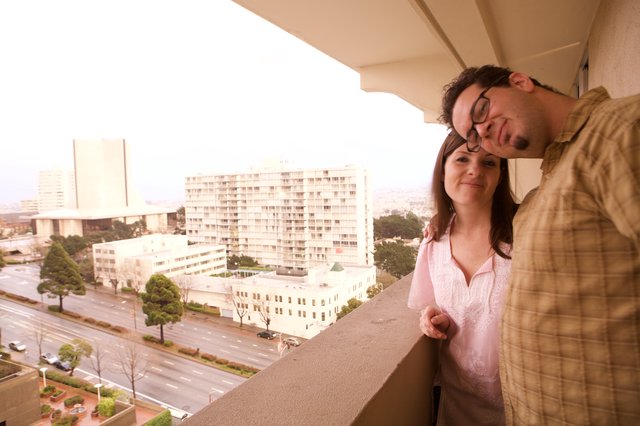 Couple Sharing a Tender Moment on City Balcony