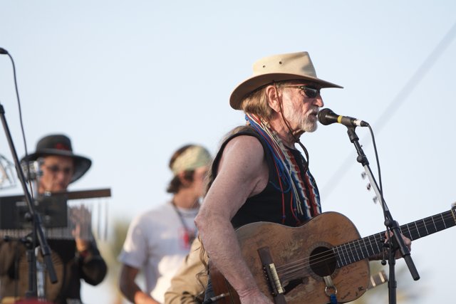 Willie Nelson strums his guitar at Coachella 2007