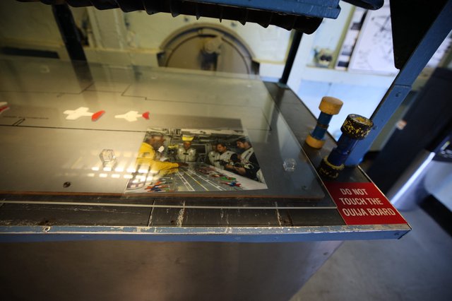 Vintage Aircraft Cockpit Display with Ouija Board Warning