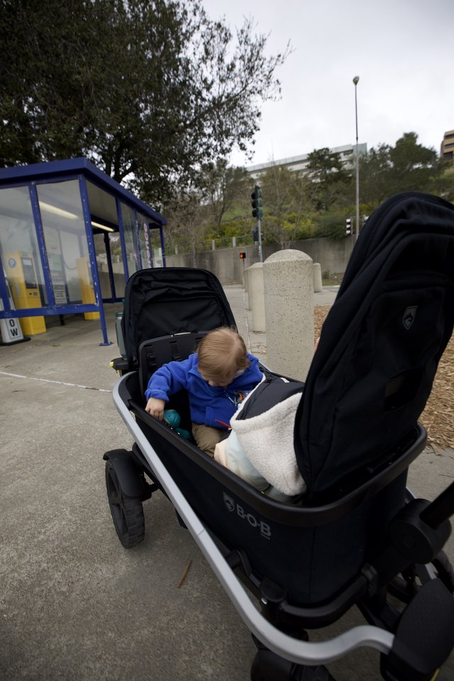Young Child in Modern BOB Stroller at Transit Station