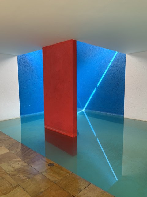 Red and Blue Wall with Water Fountain