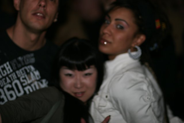 Woman with Black Hair Rocks the Night Club Scene with Friends