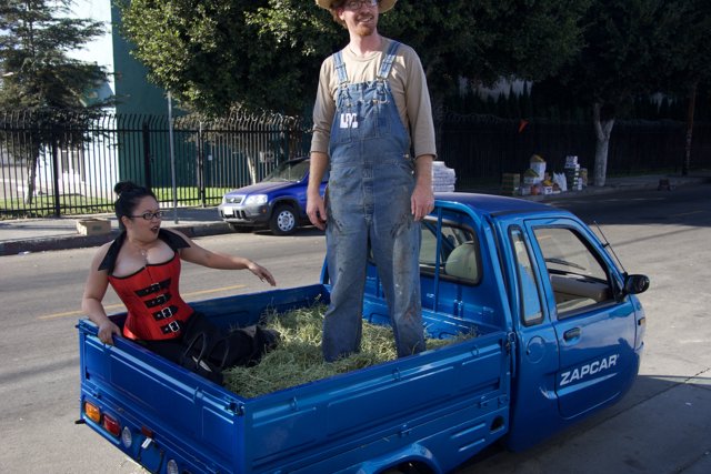 Man standing on top of a pickup truck
