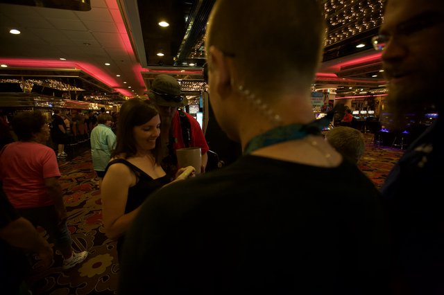 Friends Socializing Inside a Bustling Casino Floor