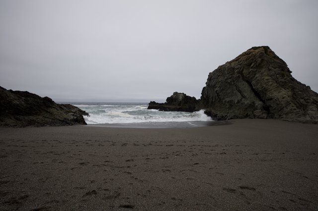 Moody Coastal Cove Framed by Ancient Sea Rocks