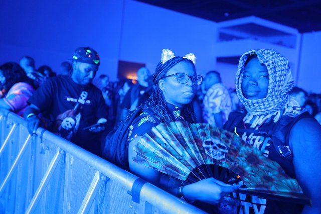 Concert Fans Bathed in Blue Light at Wobbleland