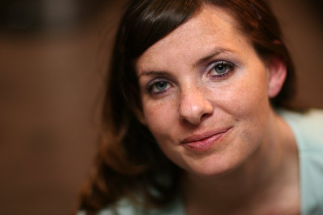 Freckled Woman with Blue Eyes Gentle Smile