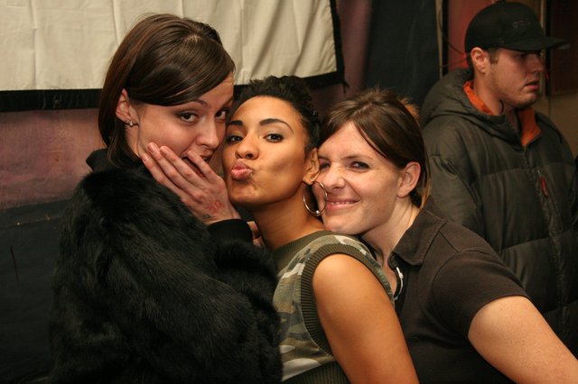 Three Friends Celebrate at a Nightclub Party