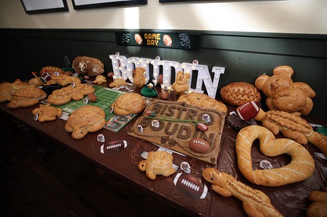 Game Day Football-Themed Bread Display with Illuminated Signage
