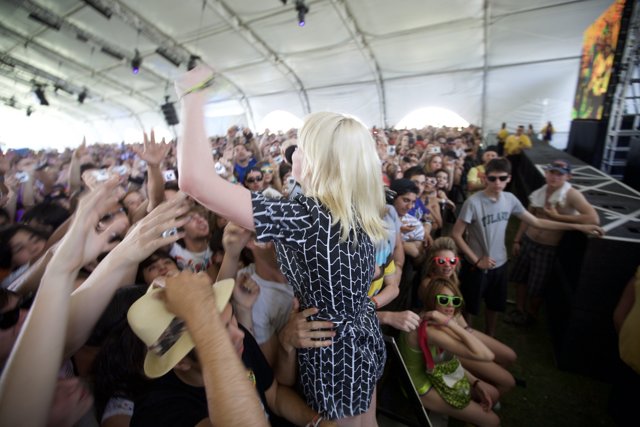 Woman in Black Dress Stands Out in Coachella Crowd