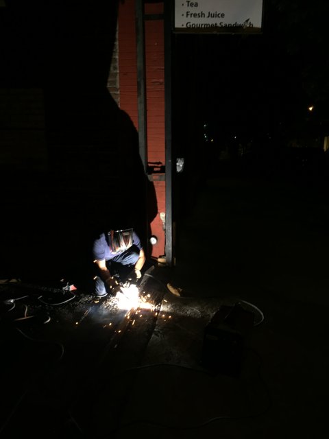 Welding on the Sidewalk at Night