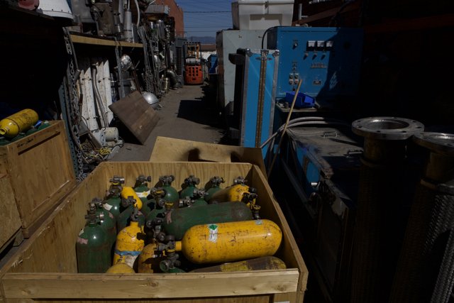 Crate of Colorful Gas Tanks at Norton Sales