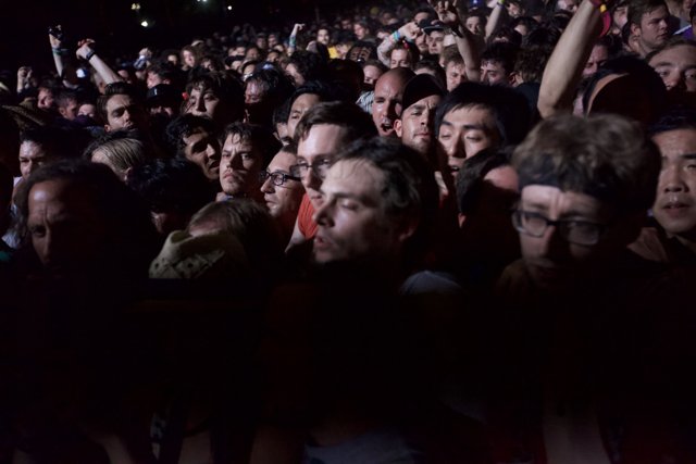 Cell Phone Light in a Sea of Faces