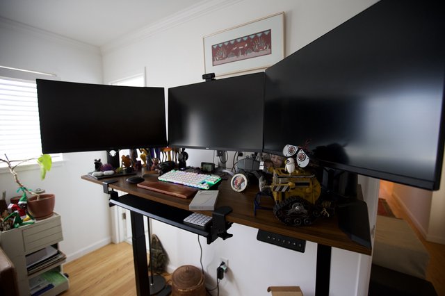 Multi-Monitor Standing Desk Workstation with Collectibles