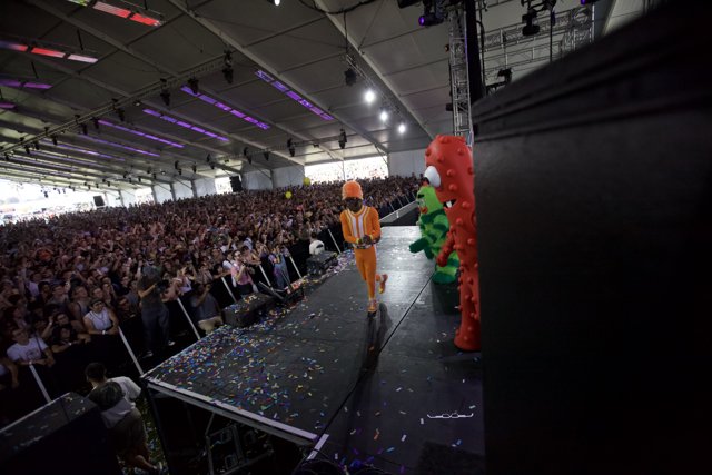 Orange Man on Stage with Confetti