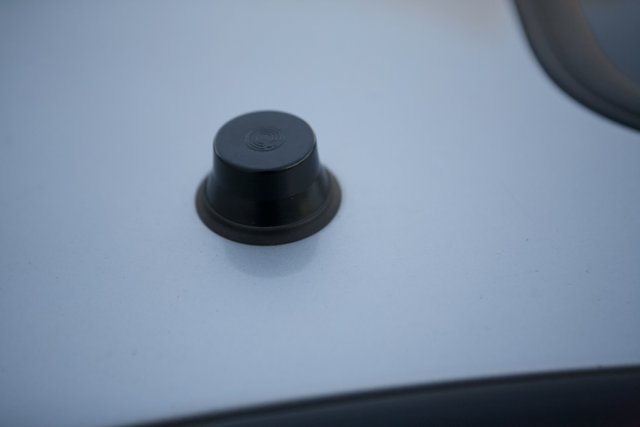 Black Button on Eclipse Car