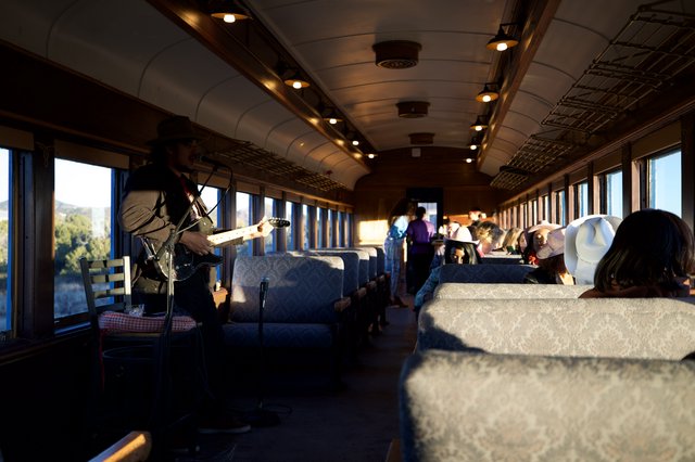 Banjo Player Performs on Vintage Train Journey