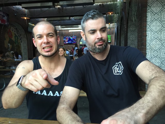Two Men Enjoying Beers at Long Beach Pub
