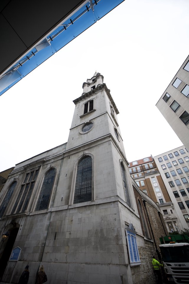 Historic Church Tower Rising Above Modern London Buildings