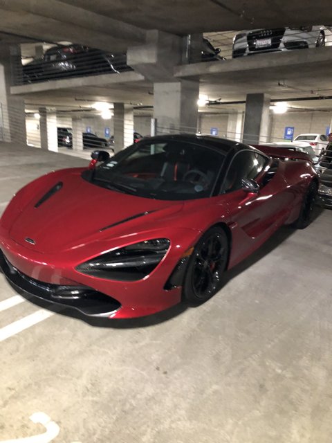 Red McLaren 570S Sports Car in Parking Garage