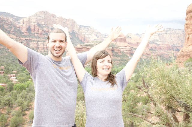 Joyful Couple Celebrating Atop Sedona Red Rocks