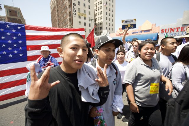 Mayday Rally Participants Wave American Flag