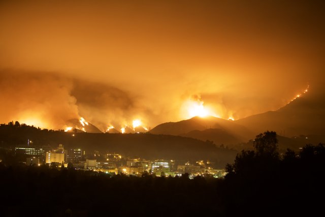 Inferno Engulfs the City and Mountains