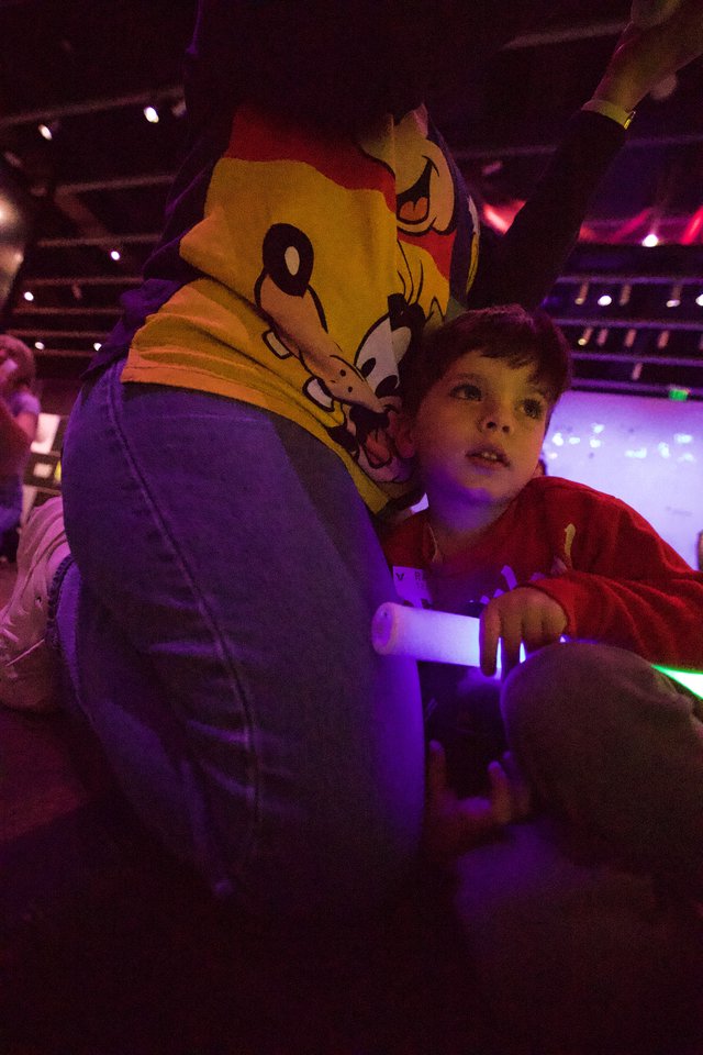 Child and Mascot at Baby Rave Event